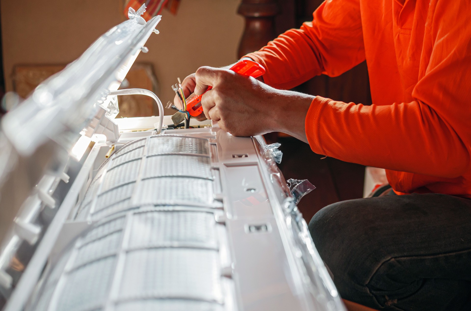 Air worker technician is installing electrical wires in Fan Coil Unit, Air conditioning technicians Prepare to  install new air conditioner in homes